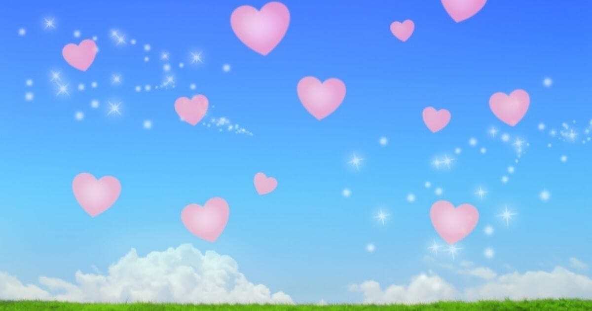 青空にピンクのハートが舞っているイラスト
